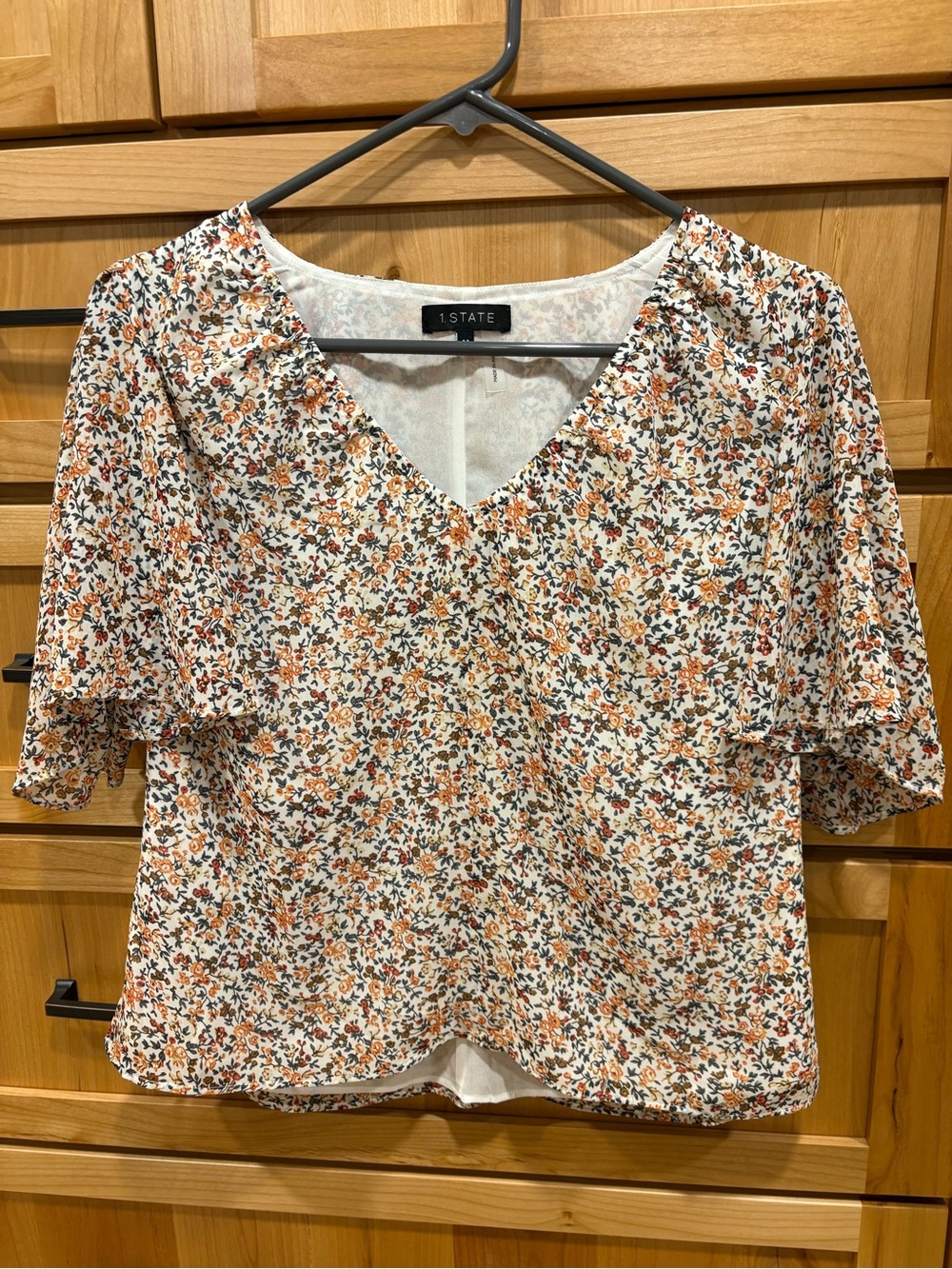 1. State Cream Floral V-Neck Flutter Sleeve Blouse